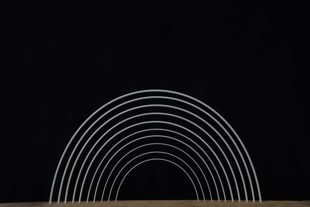 FRP rods demonstrating flexibility and strength in an arch formation